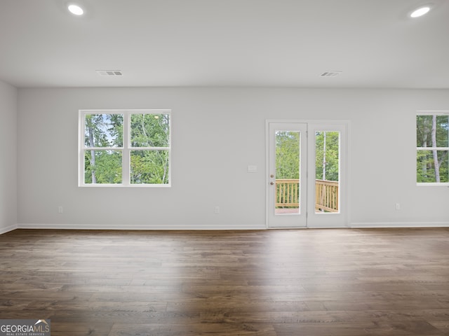 spare room featuring dark hardwood / wood-style floors