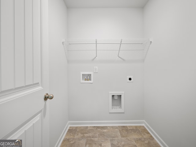 clothes washing area with washer hookup and hookup for an electric dryer