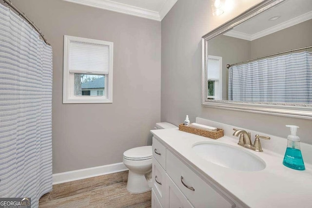 bathroom with hardwood / wood-style flooring, vanity, toilet, and crown molding