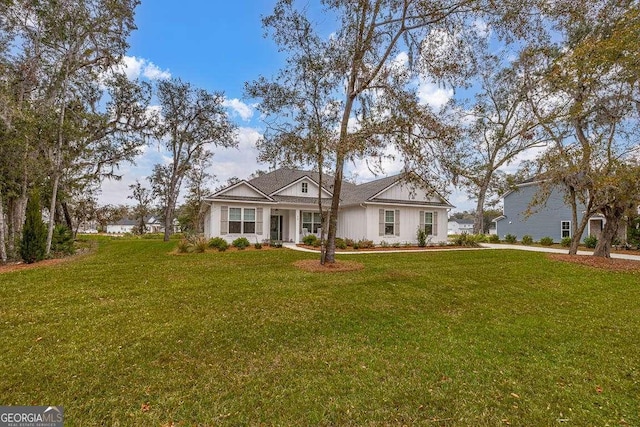 single story home with a front yard