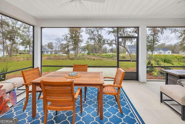 sunroom featuring a wealth of natural light and ceiling fan