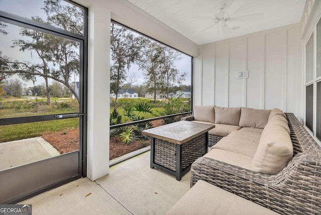 sunroom / solarium with plenty of natural light and ceiling fan