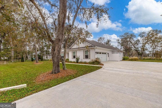 view of front of house with a front yard and a garage