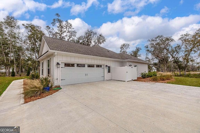 view of side of home featuring a garage