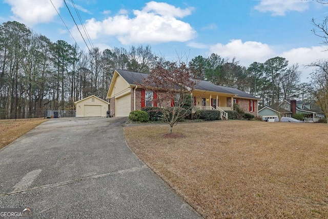 ranch-style house with covered porch and a front lawn