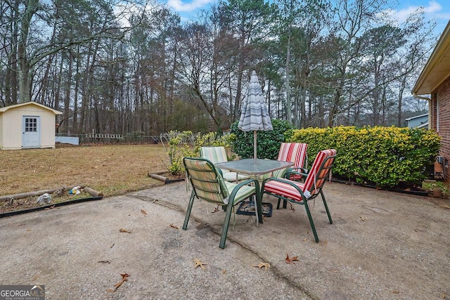 view of patio / terrace with a shed