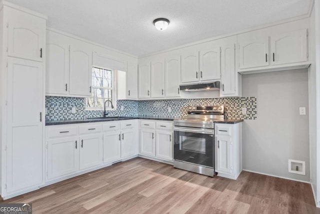 kitchen with stainless steel electric range, white cabinets, sink, a textured ceiling, and light hardwood / wood-style floors