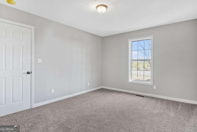 empty room featuring carpet floors