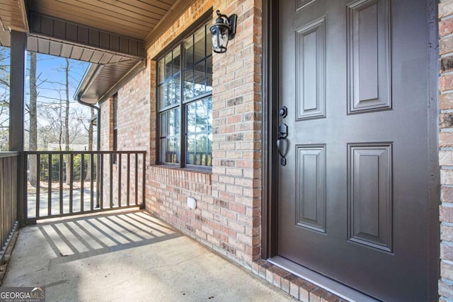 property entrance featuring covered porch