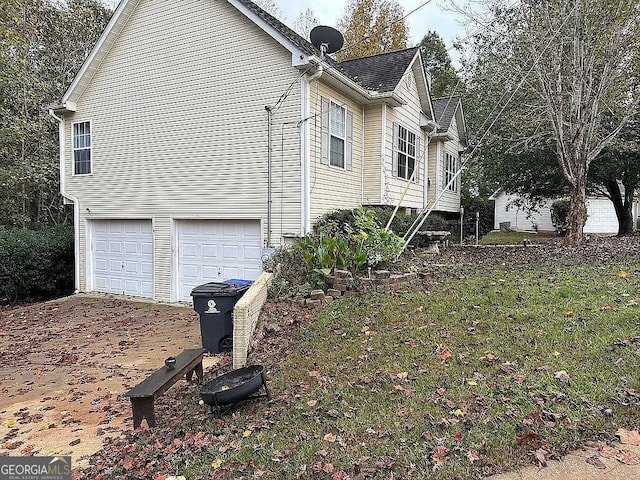 view of property exterior featuring a garage