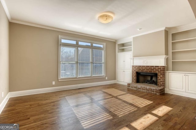 unfurnished living room with a fireplace, dark hardwood / wood-style floors, built in features, and ornamental molding