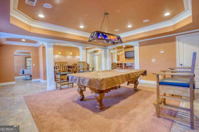 rec room with decorative columns, a raised ceiling, ornamental molding, and billiards