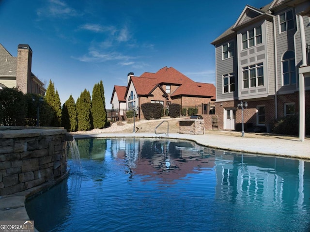 view of pool featuring pool water feature