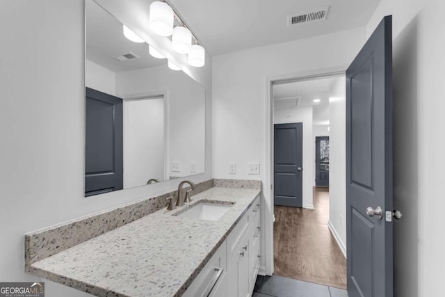 bathroom with vanity and tile patterned floors