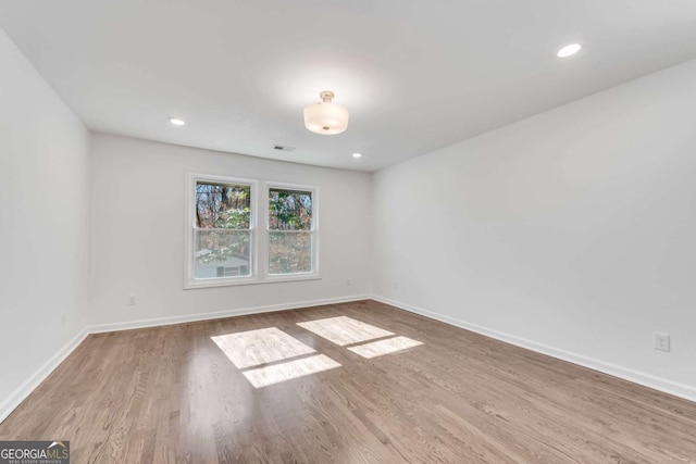 unfurnished room featuring light wood-type flooring