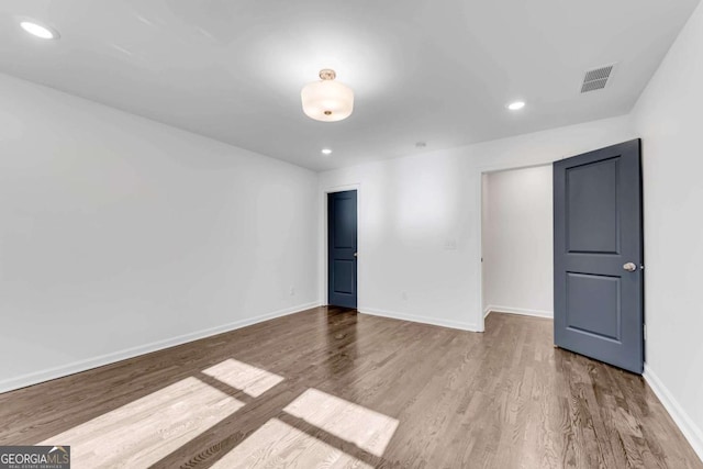 spare room featuring light hardwood / wood-style flooring