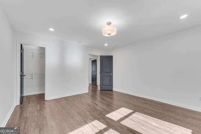 unfurnished room featuring hardwood / wood-style floors