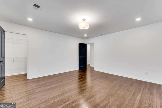 unfurnished room featuring wood-type flooring