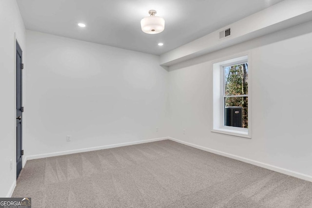 unfurnished room with carpet floors