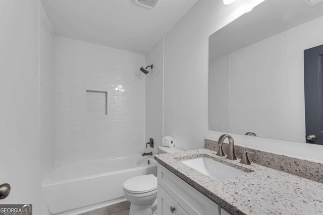 full bathroom with toilet, vanity, tiled shower / bath combo, and tile patterned flooring