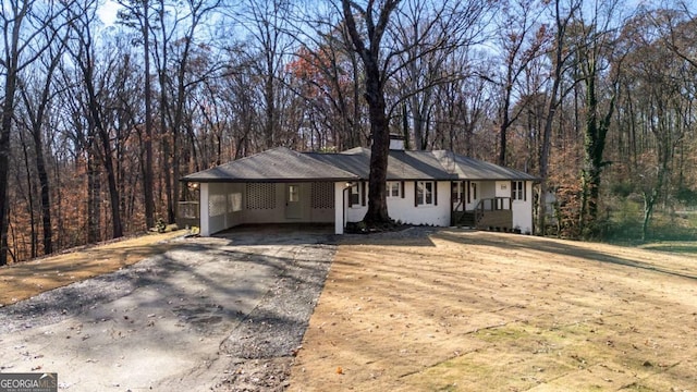 ranch-style home with a carport