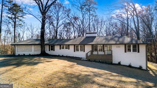 ranch-style house with a front yard