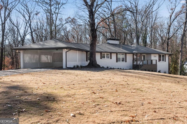 ranch-style house featuring a carport