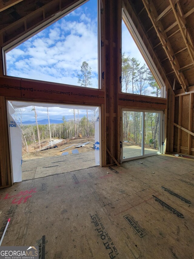 interior space featuring high vaulted ceiling