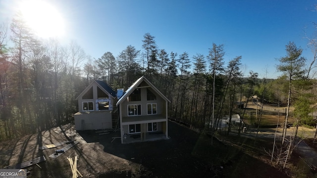 exterior space with a view of trees