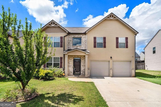 view of front of property with a front lawn and a garage