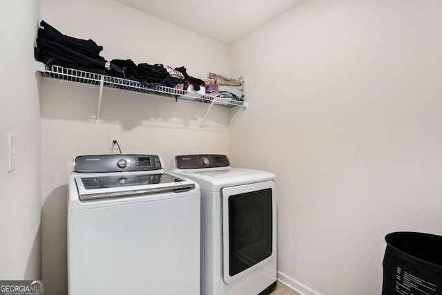 laundry area featuring washing machine and clothes dryer