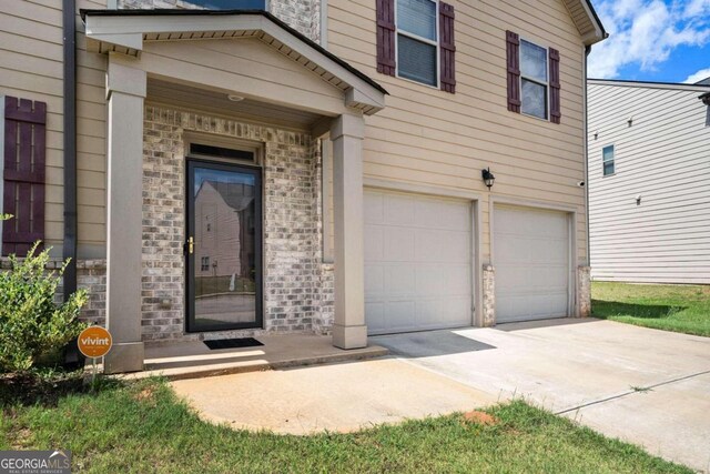 property entrance with a garage