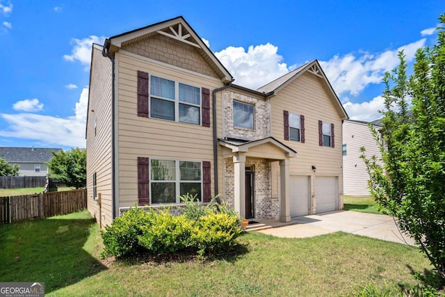 view of front of house with a garage and a front lawn