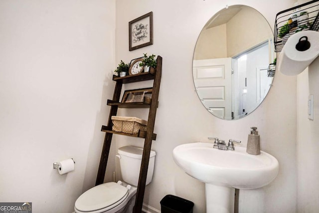 bathroom with toilet and sink