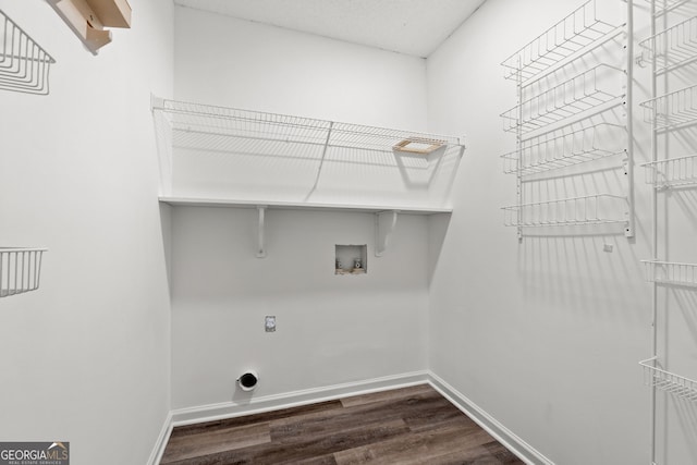 laundry area with electric dryer hookup, dark wood-type flooring, and washer hookup