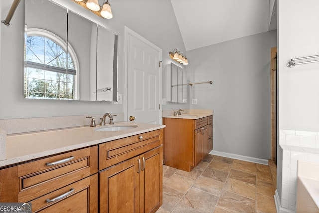 bathroom with vanity, separate shower and tub, and lofted ceiling