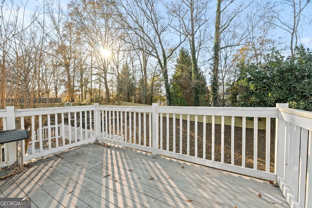 wooden terrace featuring grilling area