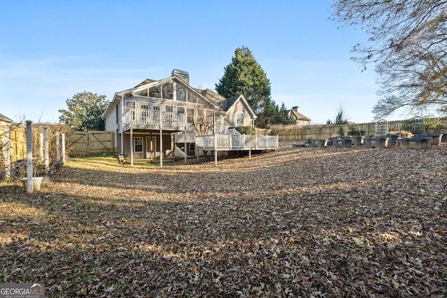 rear view of house featuring a deck