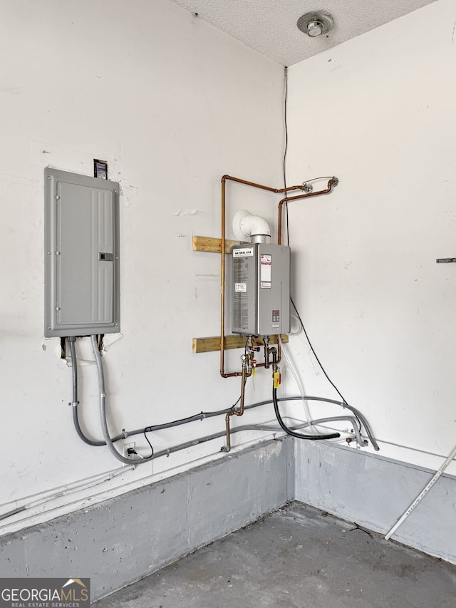 utility room featuring electric panel and tankless water heater