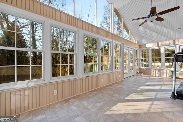 unfurnished sunroom with ceiling fan and lofted ceiling