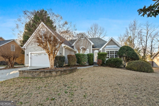 view of front of home with a front yard and a garage