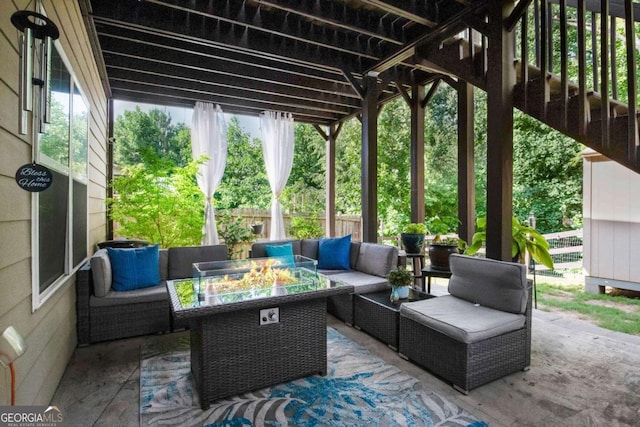 view of patio / terrace featuring an outdoor living space with a fire pit