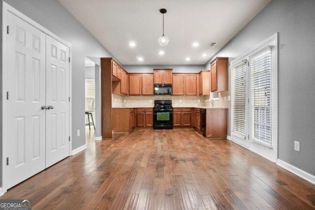 dining area featuring dark hardwood / wood-style flooring and crown molding