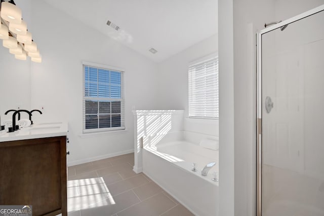 bathroom with tile patterned flooring, vanity, lofted ceiling, and plus walk in shower