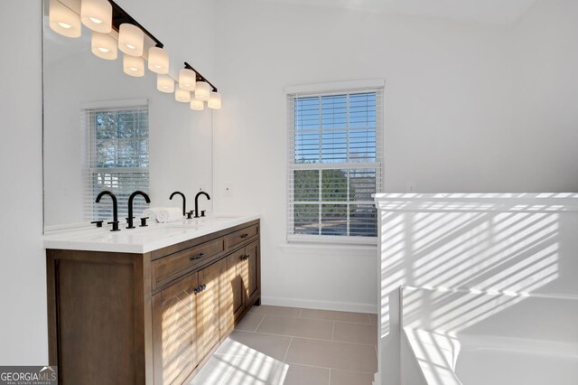 bathroom featuring vanity, tile patterned floors, and a wealth of natural light