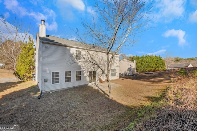 rear view of house with a patio