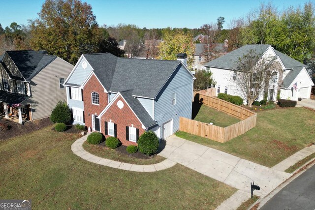 view of property featuring a front yard