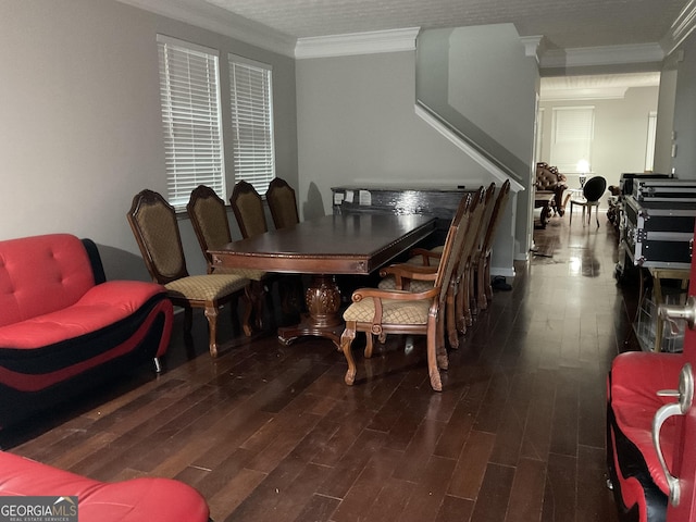 dining space featuring dark hardwood / wood-style floors and crown molding