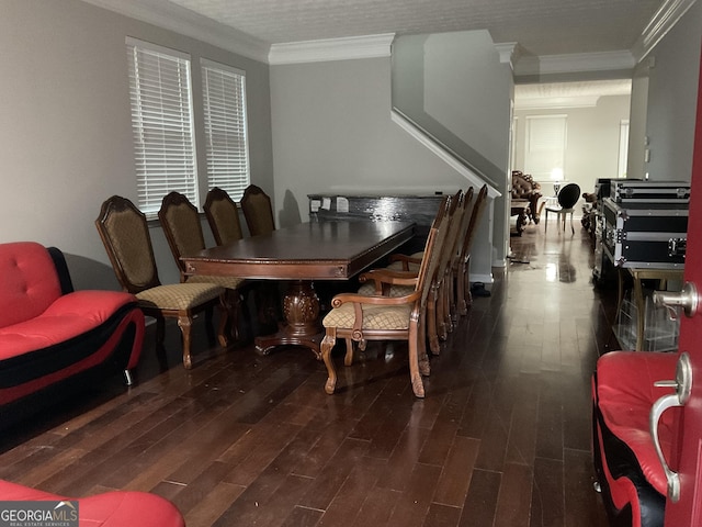 dining room featuring dark hardwood / wood-style floors and ornamental molding