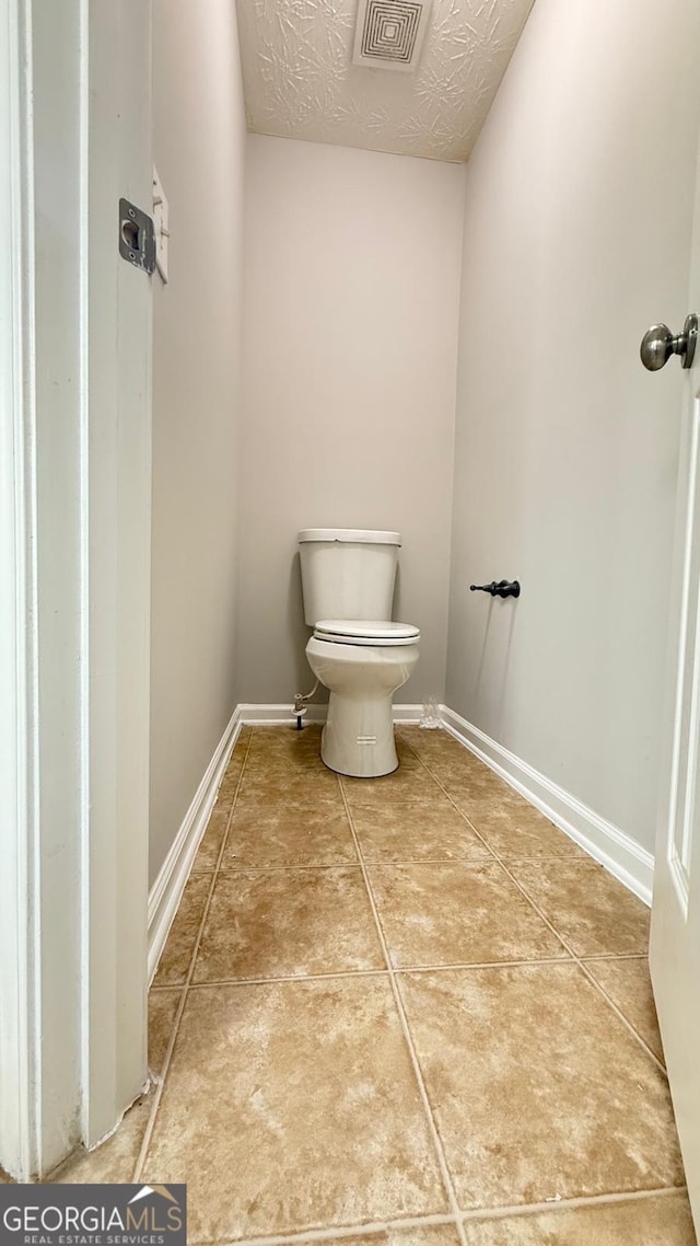 bathroom featuring toilet